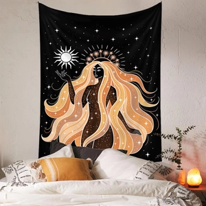 Detail of bohemian tapestry with celestial goddess design on a bedroom wall decoration
