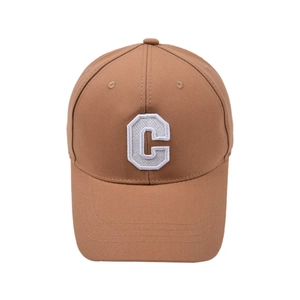 Detail view of the brown baseball cap featuring a white embroidered letter C on the front