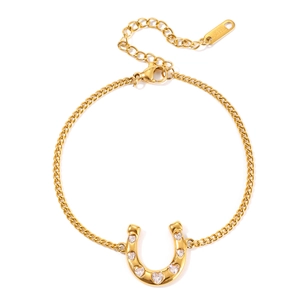 Gold stainless steel horseshoe bracelet featuring sparkling heart-shaped cubic zirconia