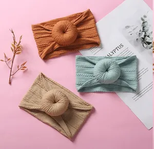 Detailed texture of baby ribbed knit headbands with soft donut knot in three colors