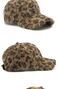 Detailed view of leopard print baseball cap featuring soft faux fur texture and warm fabric