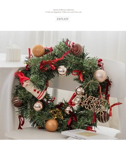 Detailed Christmas wreath featuring pine needles, colorful baubles, and Santa Claus figurine