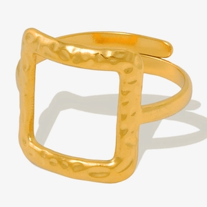 Close-up of golden square hollow ring with textured surface and adjustable open band