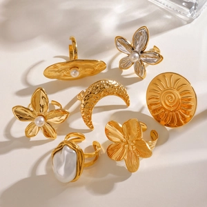 7-piece vintage gold stainless steel ring set with sun moon floral and pearl designs