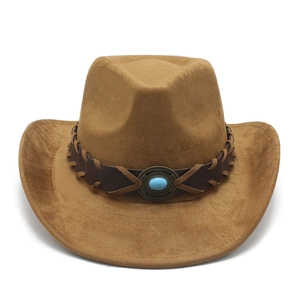 Detail of a brown suede western hat with turquoise stone and vintage metal accessory