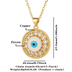 Detail showing gold-plated copper evil eye pendant with blue enamel and zircon inlay