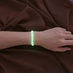 Luminous acrylic round beads bracelet with star and moon patterns glowing in the dark