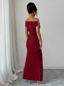 Back view of a slim-fit off-shoulder dark red evening gown showing elegant tailoring