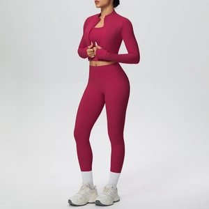 Detail of rose red 3-piece fitness set with zip-up jacket, sports bra and high-waist pants