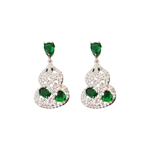 Silver drop earrings featuring green zircon stones and pearls on white background