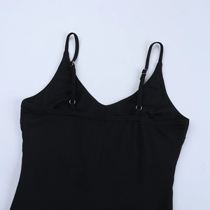 Detail view of adjustable spaghetti straps and fine fabric texture on black jumpsuit