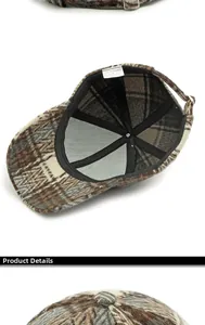 Detail view of polyester plaid baseball cap showing inner wash label and adjustable strap