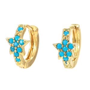 Golden hoop earrings with star pendants featuring turquoise blue stones on white background