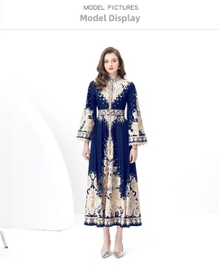 Detail of royal baroque print on navy maxi dress with stand collar and long sleeves
