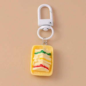 Close-up of realistic sandwich pendant keychain with colorful plastic food layers
