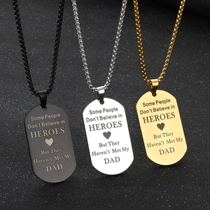 Three Father's Day dog tag necklaces in black silver and gold with hero dad engraving