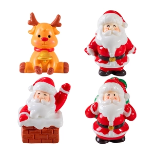 Set of four resin Christmas ornaments featuring a reindeer and Santas for table decor
