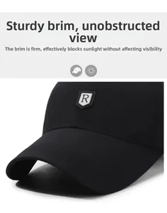 Detail of a black baseball cap featuring a stiff brim and R-letter rubberized shield logo