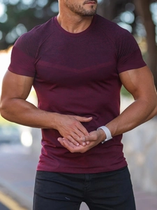 Breathable wine red men's sports t-shirt with close-up of quick-dry stretch fabric texture
