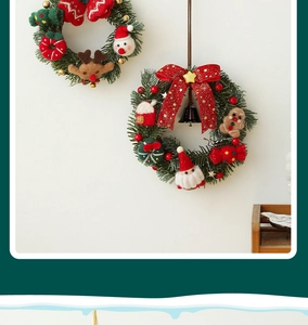 Close-up of Christmas wreath with felt reindeer, Santa, and gingerbread man ornaments