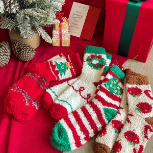Detailed view of fluffy Christmas coral fleece socks in festive holiday gift packaging