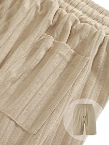Detail of khaki striped knit texture on men's casual shorts with drawstring waist