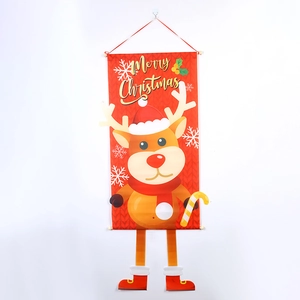 Detail of hanging Christmas reindeer door banner with festive gold Merry Christmas text