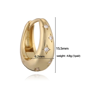 Détails des boucles d'oreilles étoile dorées avec dimensions 15,5mm x 6,2mm et poids de 4,8g