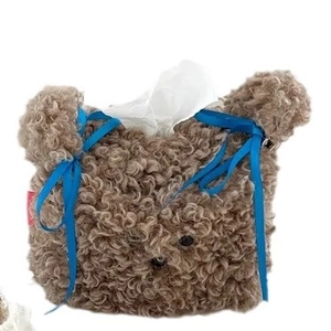 Teddy plush dog-shaped tissue box cover in coffee brown with a blue ribbon bow