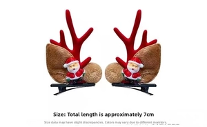 Detailed view of Christmas reindeer antler clips with Santa dolls and red flocking