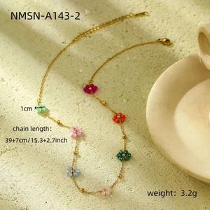 Detailed view of bohemian gold flower necklace with size 39+7cm and weight 3.2g