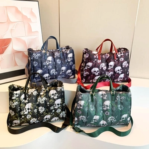Quilted tote bags with dark skull and floral prints in blue, red, black, and green
