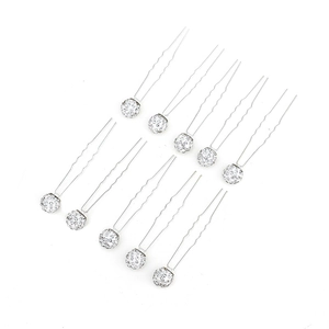 Close-up of 10-piece U-shaped hair pins with sparkling white rhinestones for bridal styling