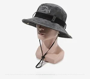 Detail of dark grey washed cotton bucket hat with white embroidery and adjustable wind rope