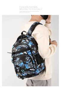 Side view of student wearing a soccer themed backpack with blue and brown graffiti