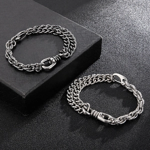 Men's double Cuban chain bracelet in stainless steel with mechanical clasp on black box
