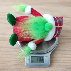 Detailed close-up showing the 136.6g weight of this festive Christmas gnome plush