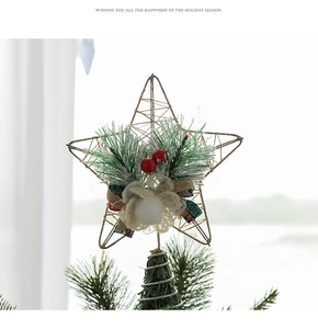Detailed view of wire star tree topper with pine needles, red berries and plaid bow