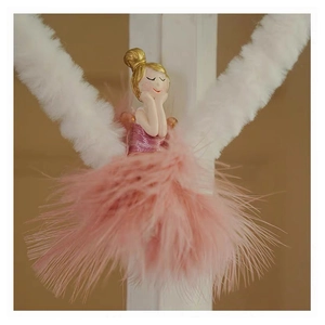 Detail of a pink feather plush angel ornament with golden hair for Christmas tree decor