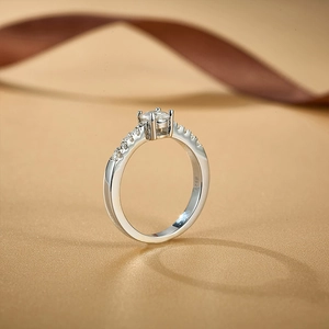 Macro view of round brilliant-cut moissanite and S925 sterling silver diamond ring band
