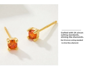 Detail of four-prong set S925 silver stud earrings with orange zircon gemstones
