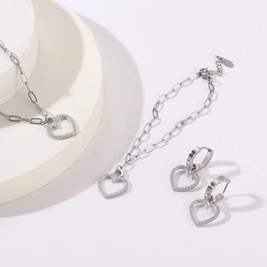 Close-up of sparkling heart jewelry set featuring silver CNC zircon necklace and earrings