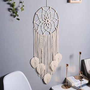 Bohemian woven macrame wall hanging dreamcatcher with leaf fringe in home interior