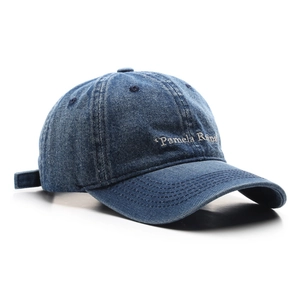 Classic dark blue denim baseball cap featuring white Pamela Reif embroidery on the front