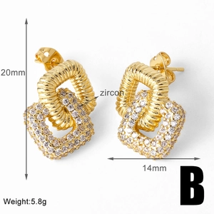 Detail view of square gold twisted earrings with cubic zirconia and 20mm height measurements