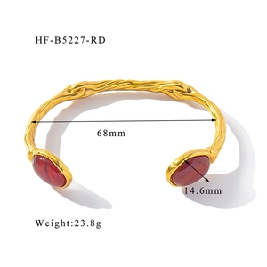 Detail shot of vintage 18K gold plated steel cuff with red natural stone and dimensions
