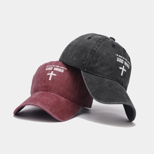 Vintage washed cotton baseball caps in burgundy and charcoal with God Wins graphic print