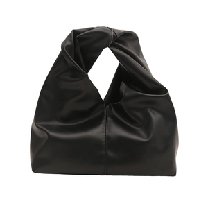 Minimalist black PU leather handbag with trendy knotted handle design on white background
