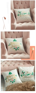 Detailed view of the gold foil Merry Christmas lettering on a soft white holiday pillow cover
