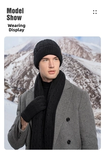 Outdoor model wearing black knit beanie hat, scarf, and gloves set for winter warmth